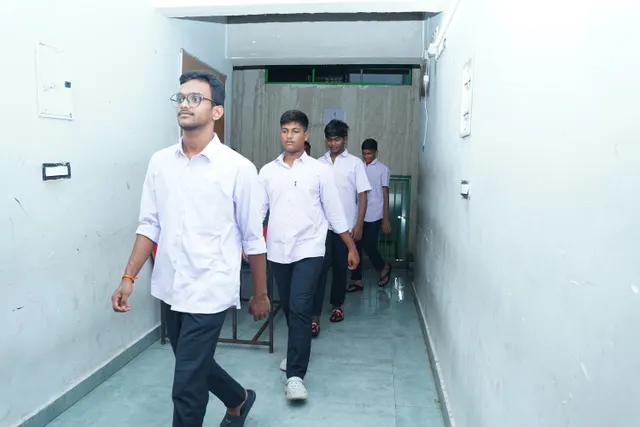 Students and faculty in the corridor